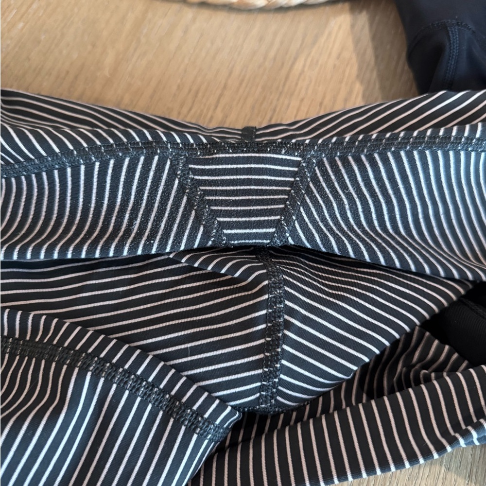 2 Lululemon High-Rise Leggings. 1 striped and 1 black - Picture 3 of 4